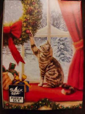 Black Sea Puzzles Cat playing with Christmas Wreath - obrázek puzzlí