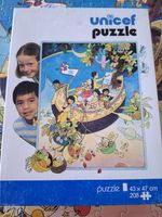 Unicef Unicef 7700 - obrázek puzzlí