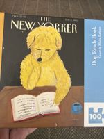 New York Puzzle Company Dog reads book - puzzle image